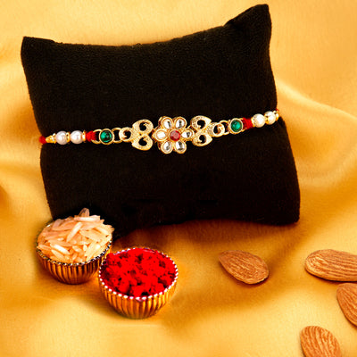 Sukkhi Delightful Gold Plated Floral Rakhi with Roli Chawal and Raksha Bandhan Greeting Card for Men