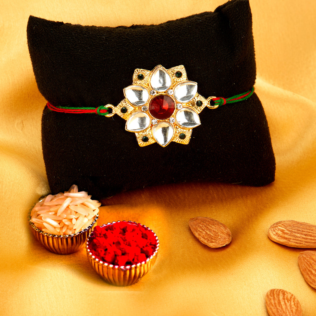 Sukkhi Classy Gold Plated Floral Rakhi with Roli Chawal and Raksha Ban