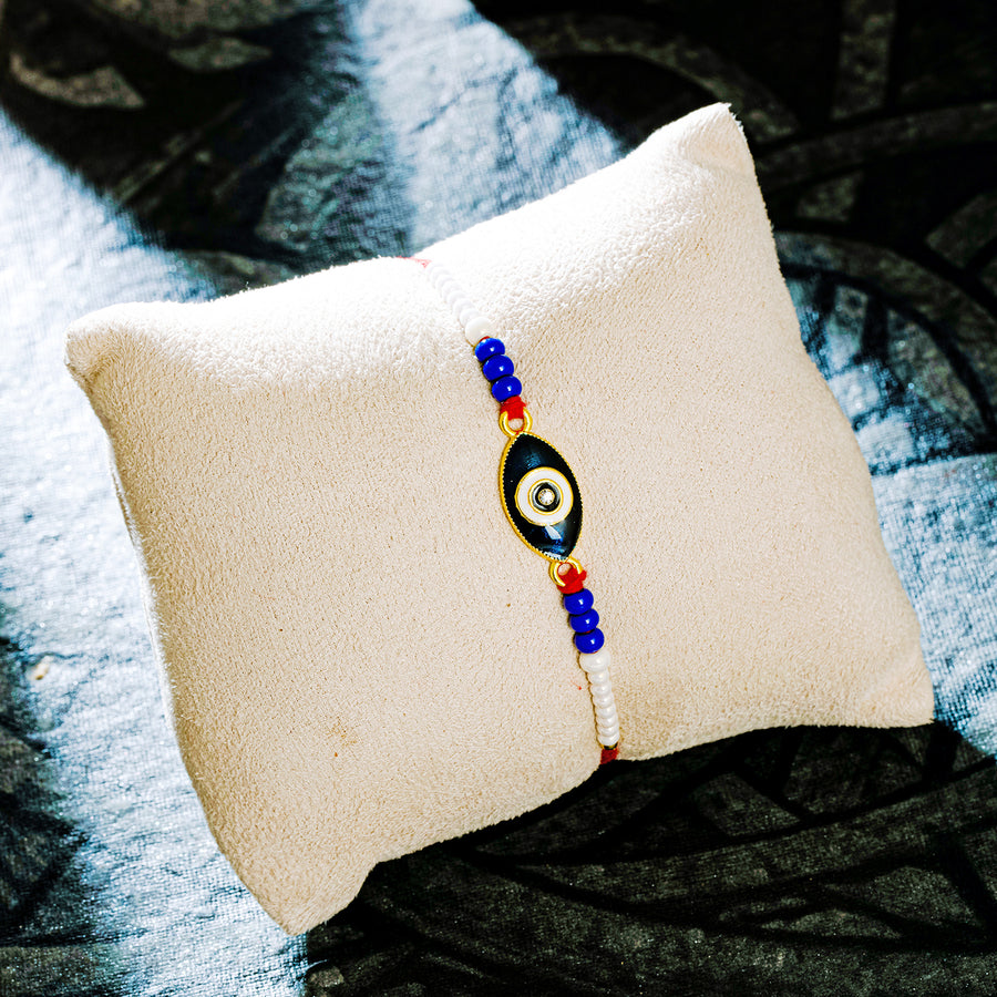 Sukkhi Attractive Gold Plated Evil Eye Rakhi with Roli Chawal and Raksha Bandhan Greeting Card For Men