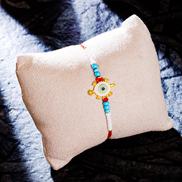 Sukkhi Delightful Gold Plated Turtle Rakhi with Roli Chawal and Raksha ...