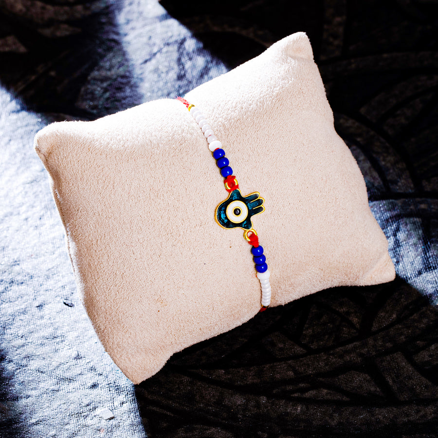 Sukkhi Glitzy Gold Plated Evil Eye Rakhi with Roli Chawal and Raksha Bandhan Greeting Card For Men