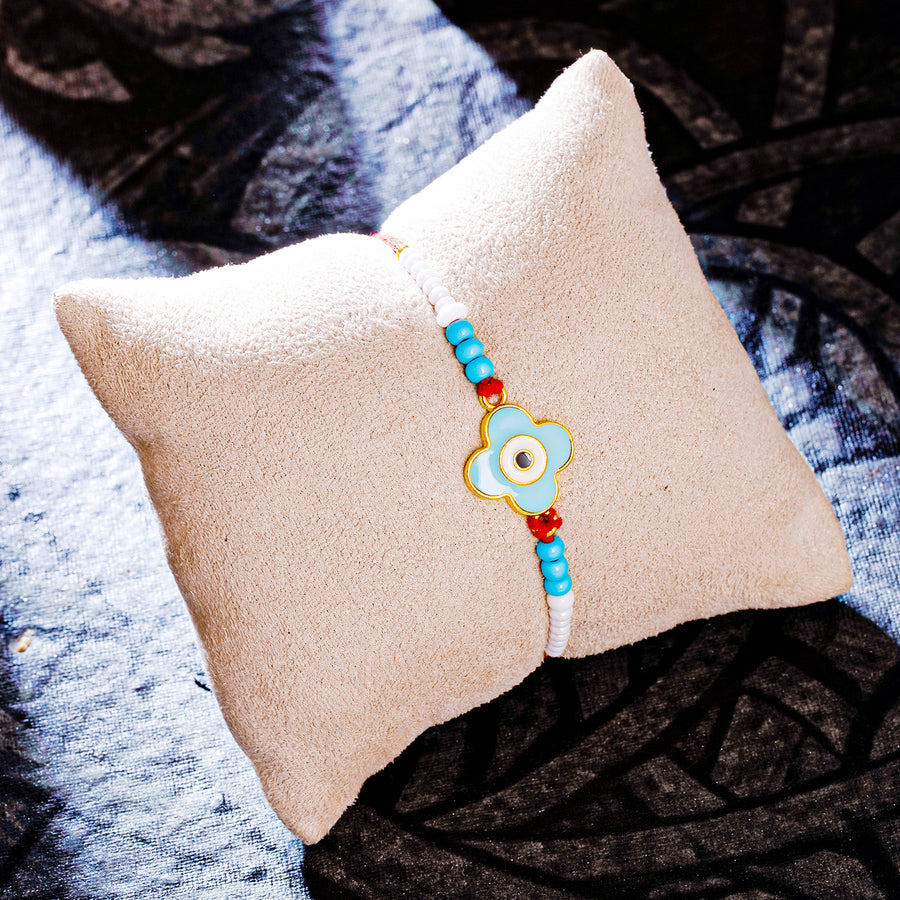 Sukkhi Brilliant Gold Plated Evil Eye Rakhi with Roli Chawal and Raksha Bandhan Greeting Card For Men