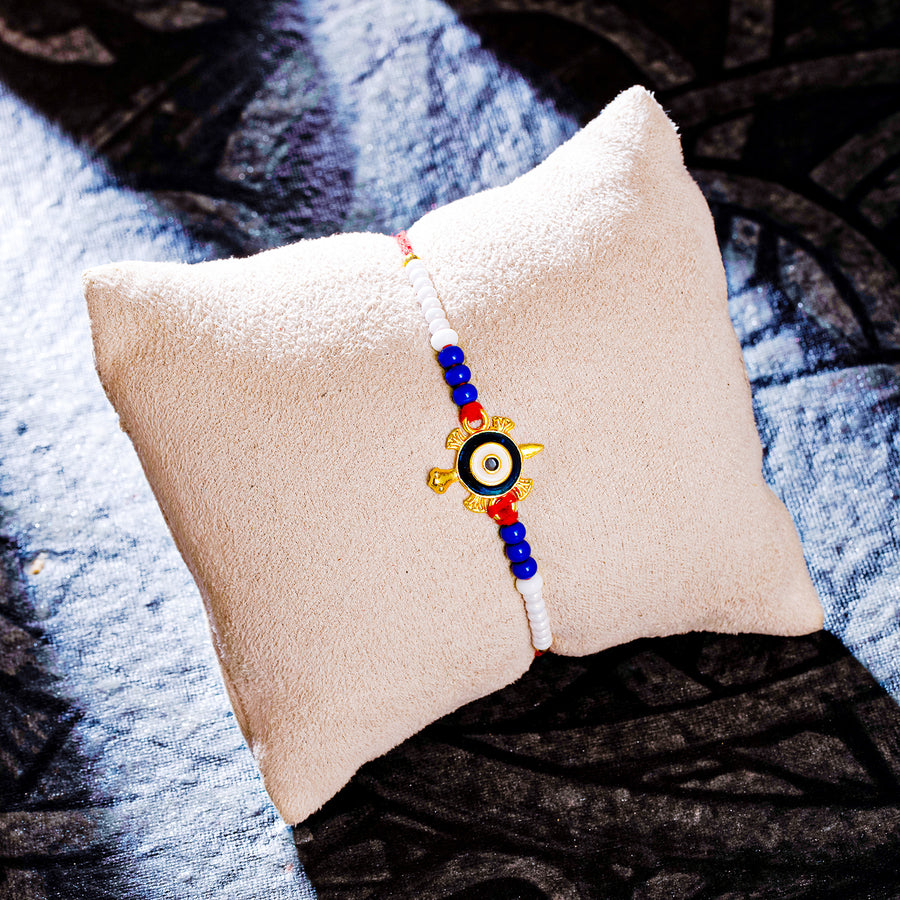 Sukkhi Ethnic Gold Plated Turtle & Evil Eye Rakhi with Roli Chawal and Raksha Bandhan Greeting Card For Men