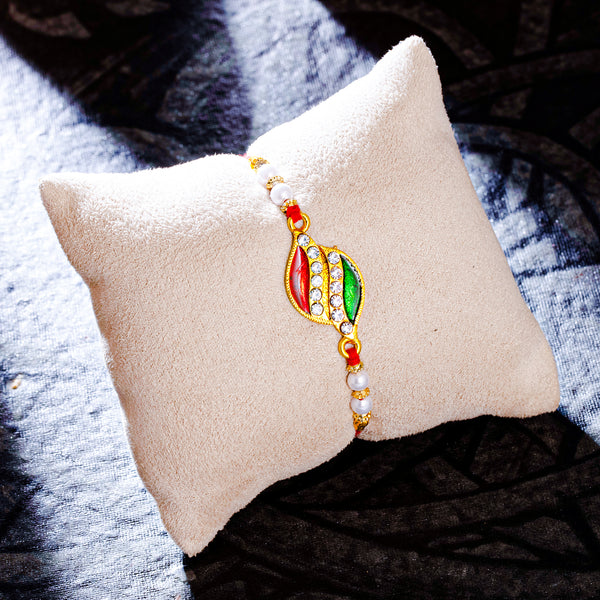 Sukkhi Glitzy Gold Plated Meenakari Rakhi with Roli Chawal and Raksha ...