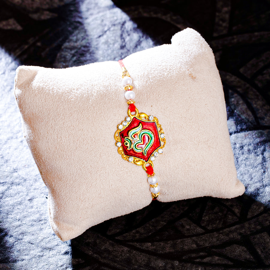 Sukkhi Fashionable Gold Plated OM Meenakari Rakhi with Roli Chawal and Raksha Bandhan Greeting Card For Men