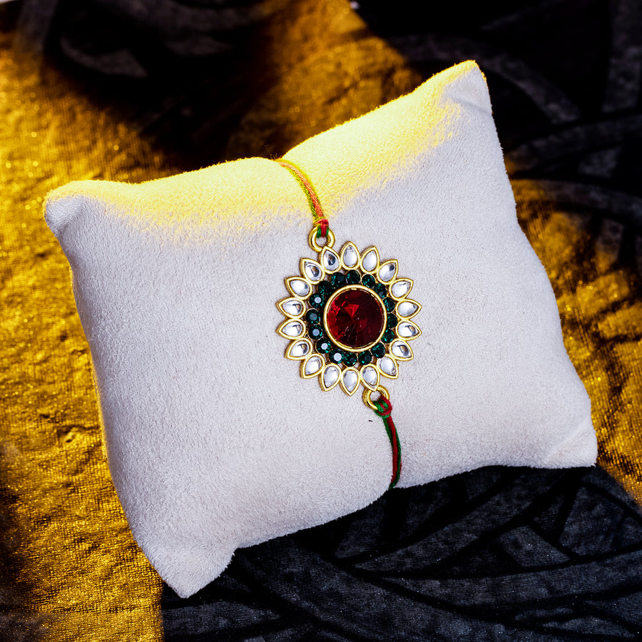 Sukkhi Glemaing Gold Plated Floral Rakhi with Roli Chawal and Raksha Bandhan Greeting Card For Men