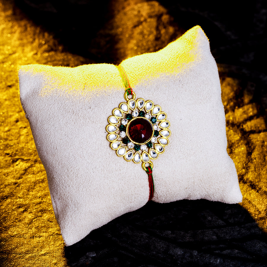 Sukkhi Glittery Gold Plated Floral Rakhi with Roli Chawal and Raksha Bandhan Greeting Card For Men