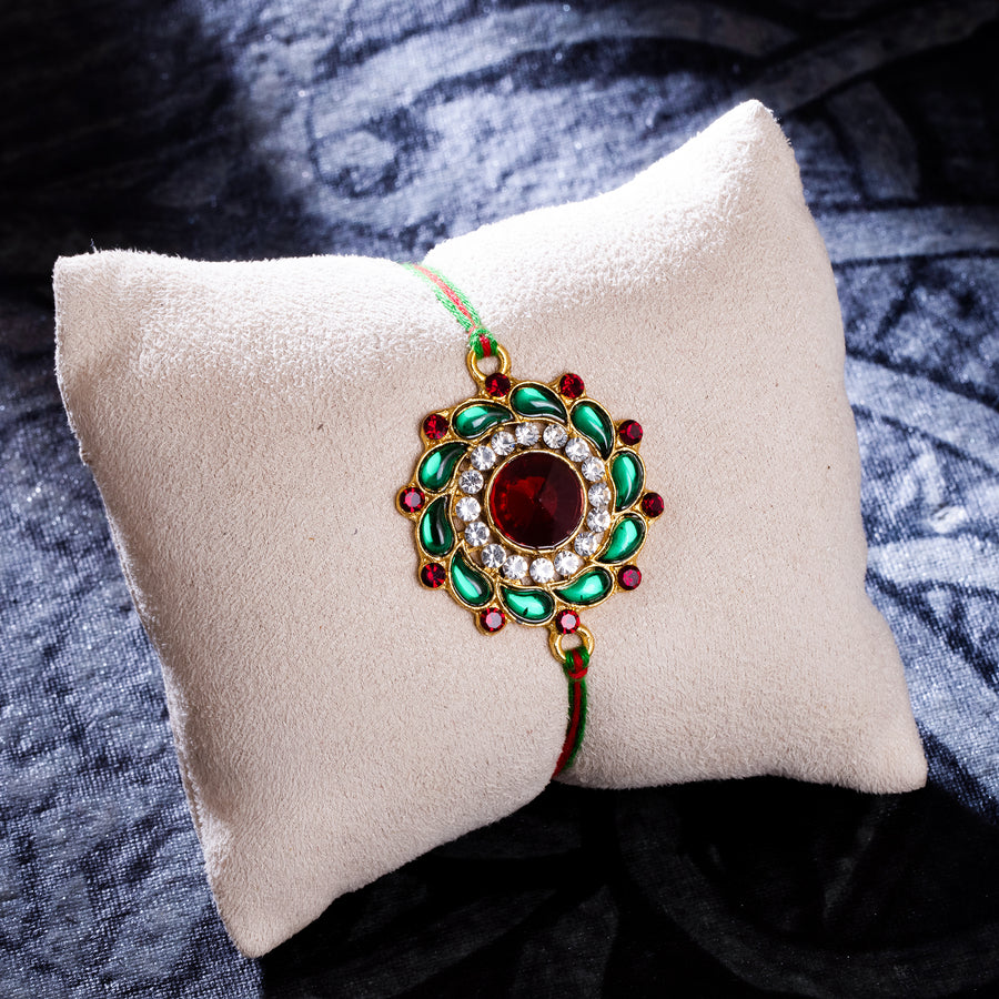 Sukkhi Delightful Gold Plated Floral Rakhi with Roli Chawal and Raksha Bandhan Greeting Card For Men