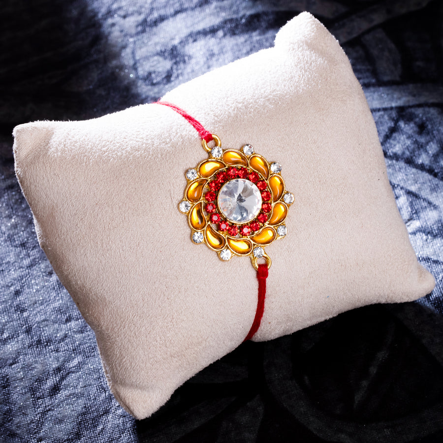 Sukkhi Lovely Gold Plated Floral Rakhi with Roli Chawal and Raksha Bandhan Greeting Card For Men