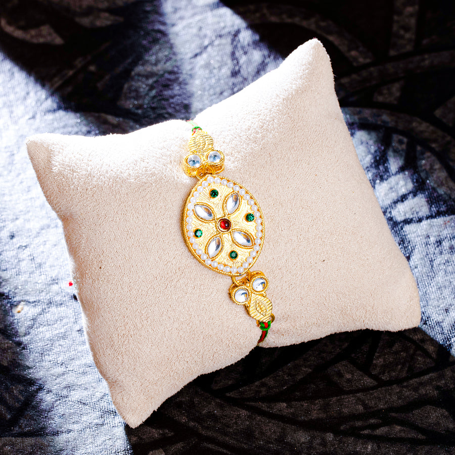 Sukkhi Glossy Gold Plated Kundan Rakhi with Roli Chawal and Raksha Bandhan Greeting Card For Men