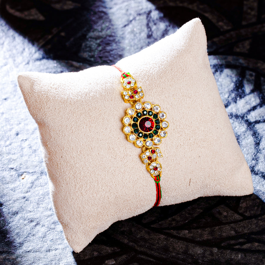 Sukkhi Lavish Gold Plated Floral Rakhi with Roli Chawal and Raksha Bandhan Greeting Card For Men