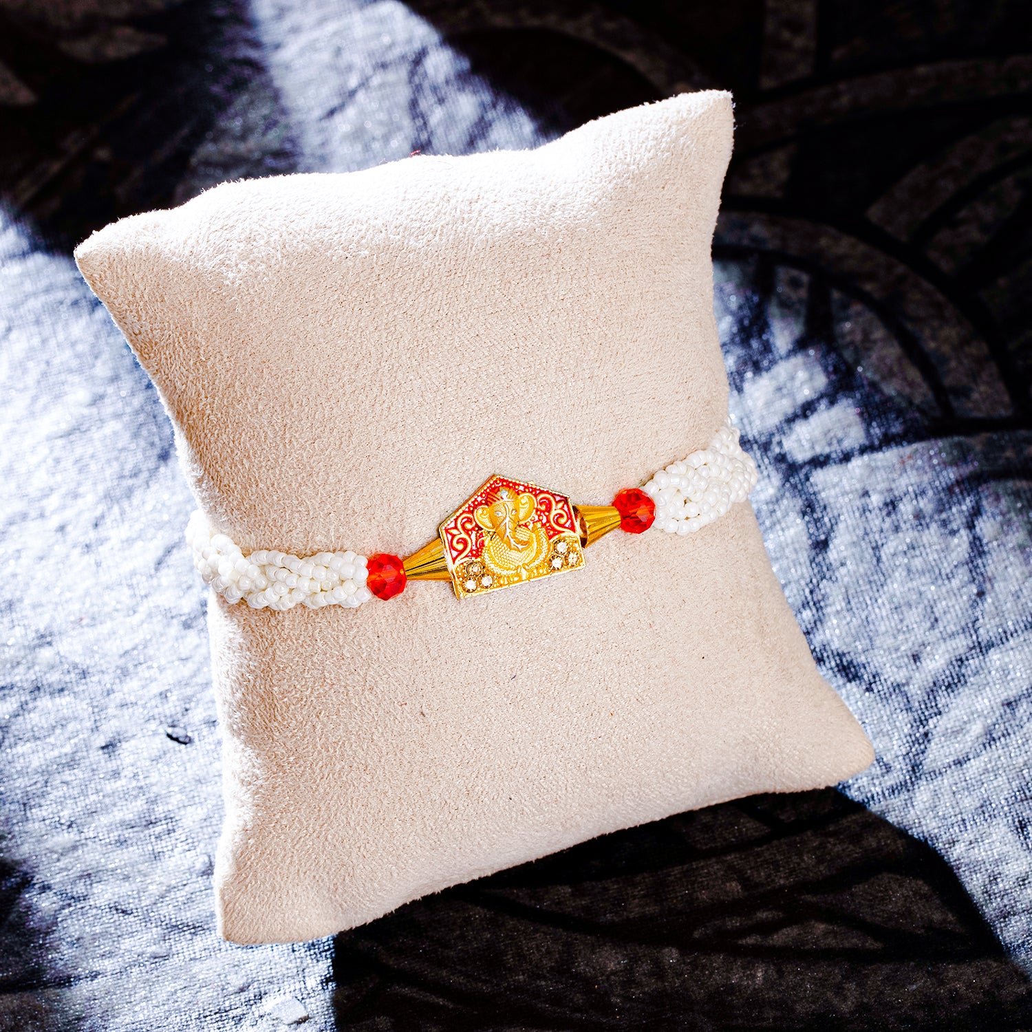 Sukkhi Exclusive Gold Plated Ganesh Rakhi with Roli Chawal and Raksha Bandhan Greeting Card For Men