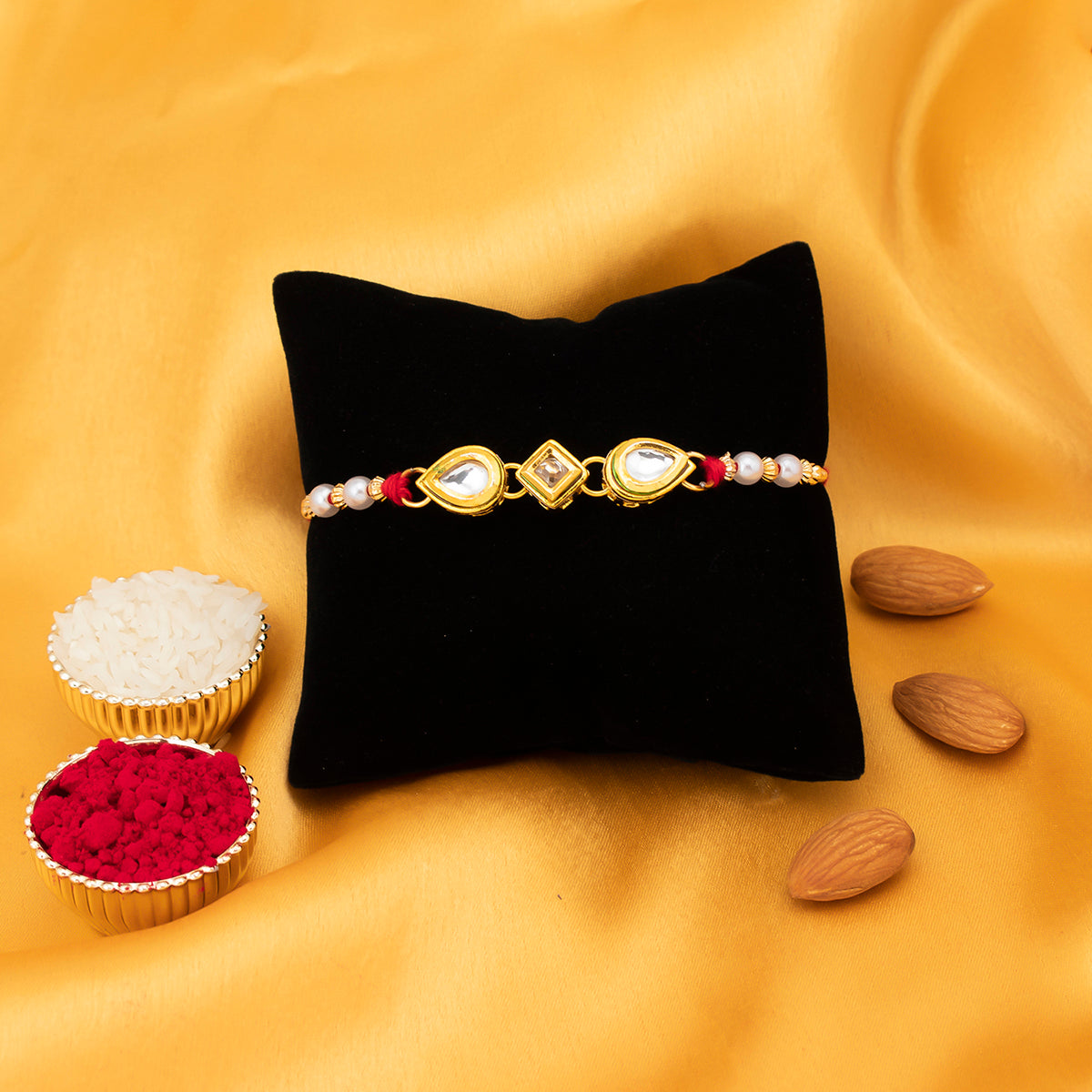 Sukkhi Finely Gold Plated Kundan and Pearl Rakhi with Roli Chawal and Raksha Bandhan Greeting Card For Men