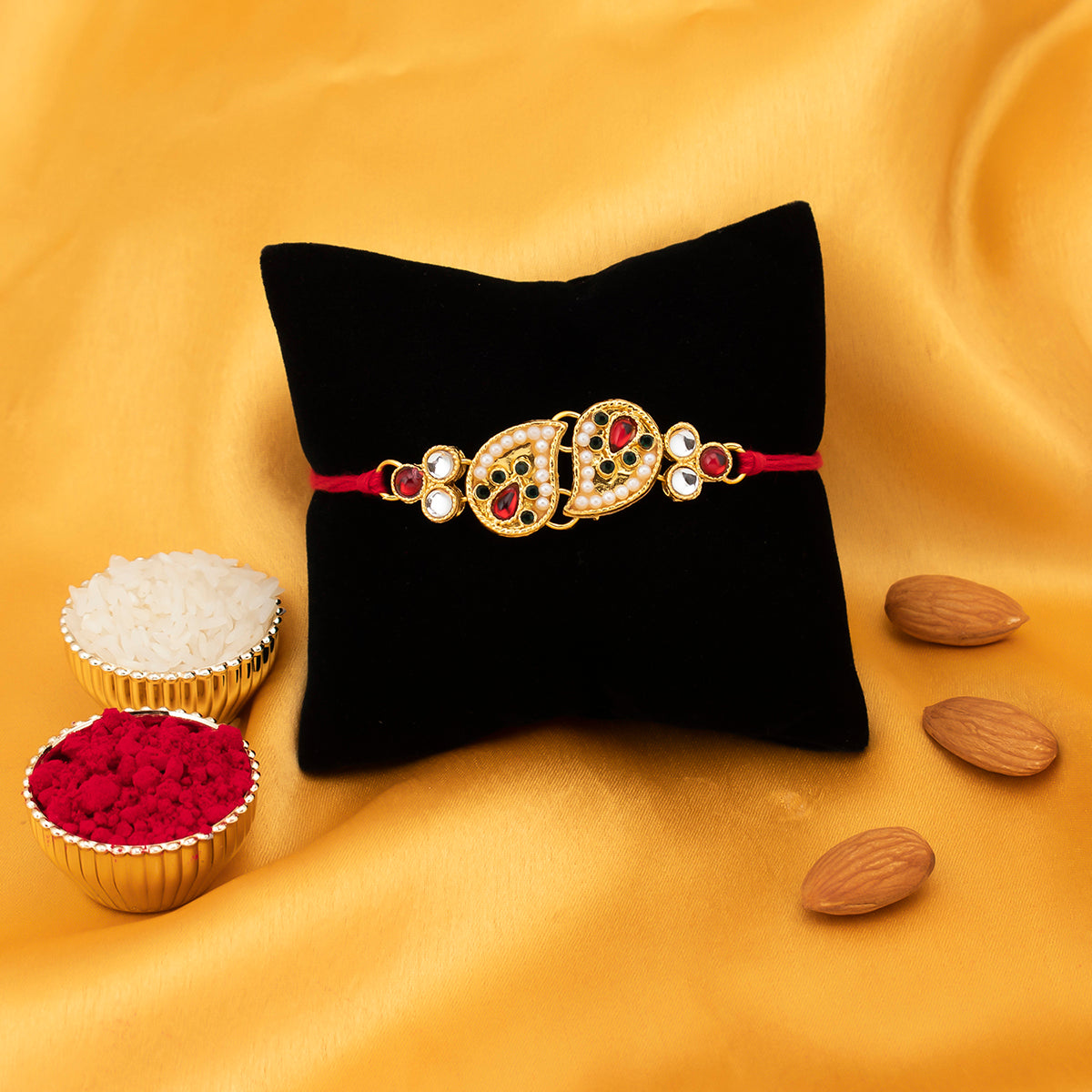 Sukkhi Exotic Twisted Pear Gold Plated rakhi for brother with Roli Chawal and Raksha Bandhan Greeting Card For Men