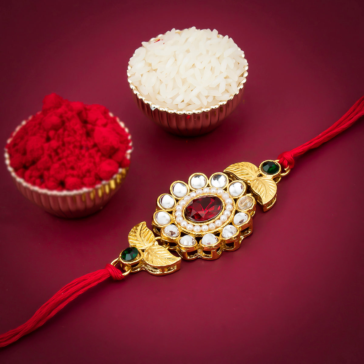 Sukkhi Sleek Gold Plated Floral Rakhi for brother with Roli Chawal and Raksha Bandhan Greeting Card For Men