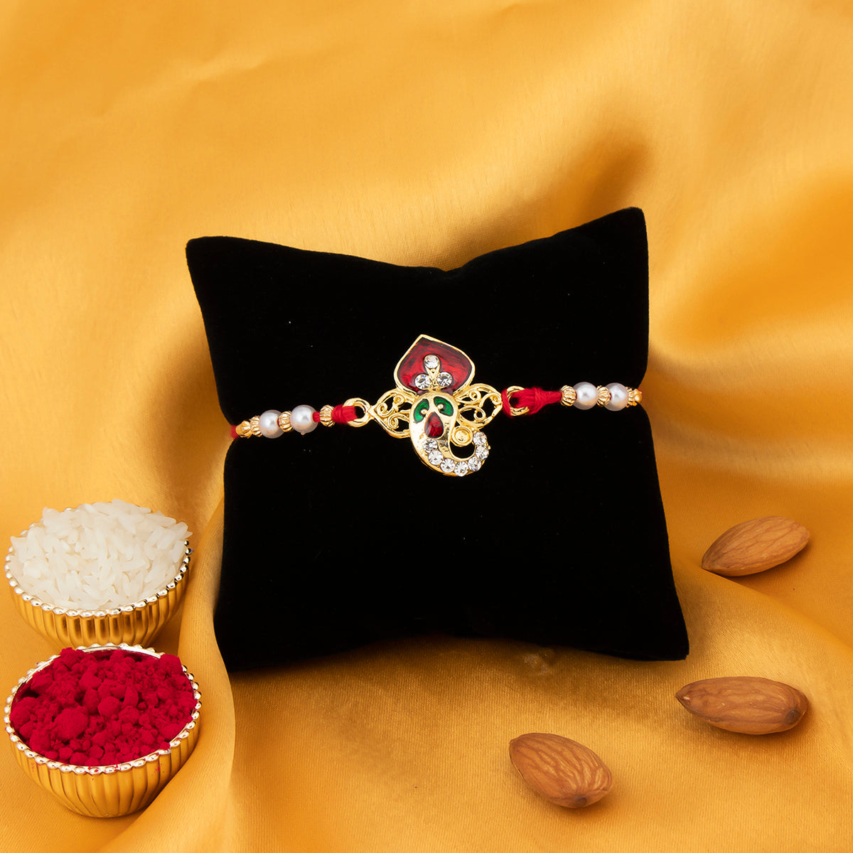 Sukkhi Fabulous Gold Plated Meenakari Ganesh Rakhi with Roli Chawal and Raksha Bandhan Greeting Card For Men