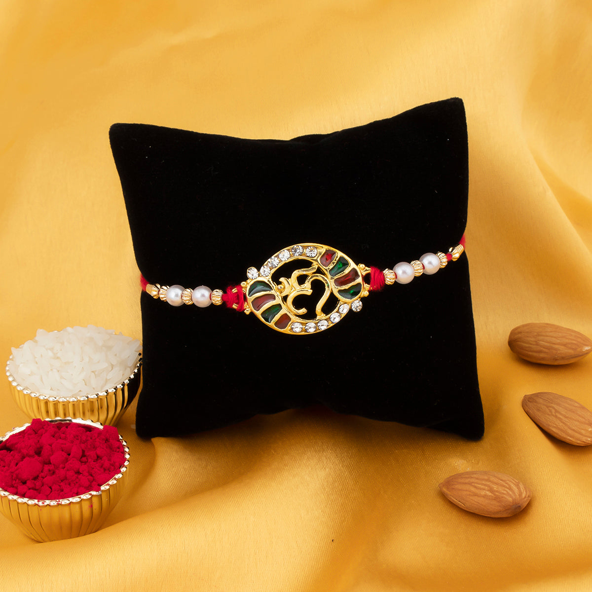 Sukkhi Ravishing Gold Plated Meenakari OM rakhi with Roli Chawal and Raksha Bandhan Greeting Card For Men