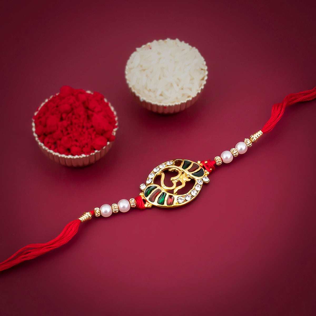 Sukkhi Ravishing Gold Plated Meenakari OM rakhi with Roli Chawal and Raksha Bandhan Greeting Card For Men