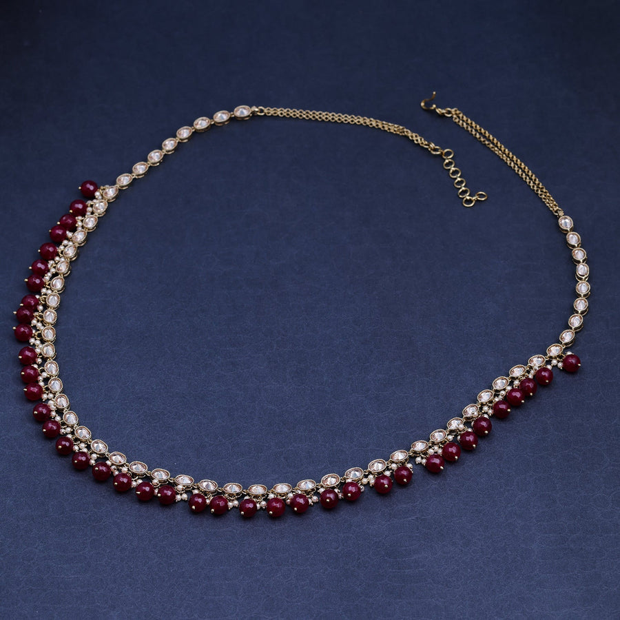 Sukkhi Maroon Gold Plated Reverse AD & Pearl KamarBand For Women