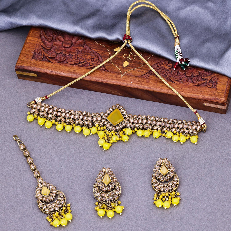 Sukkhi Yellow Gold Plated Reverse AD & Pearl Choker Necklace Set For Women