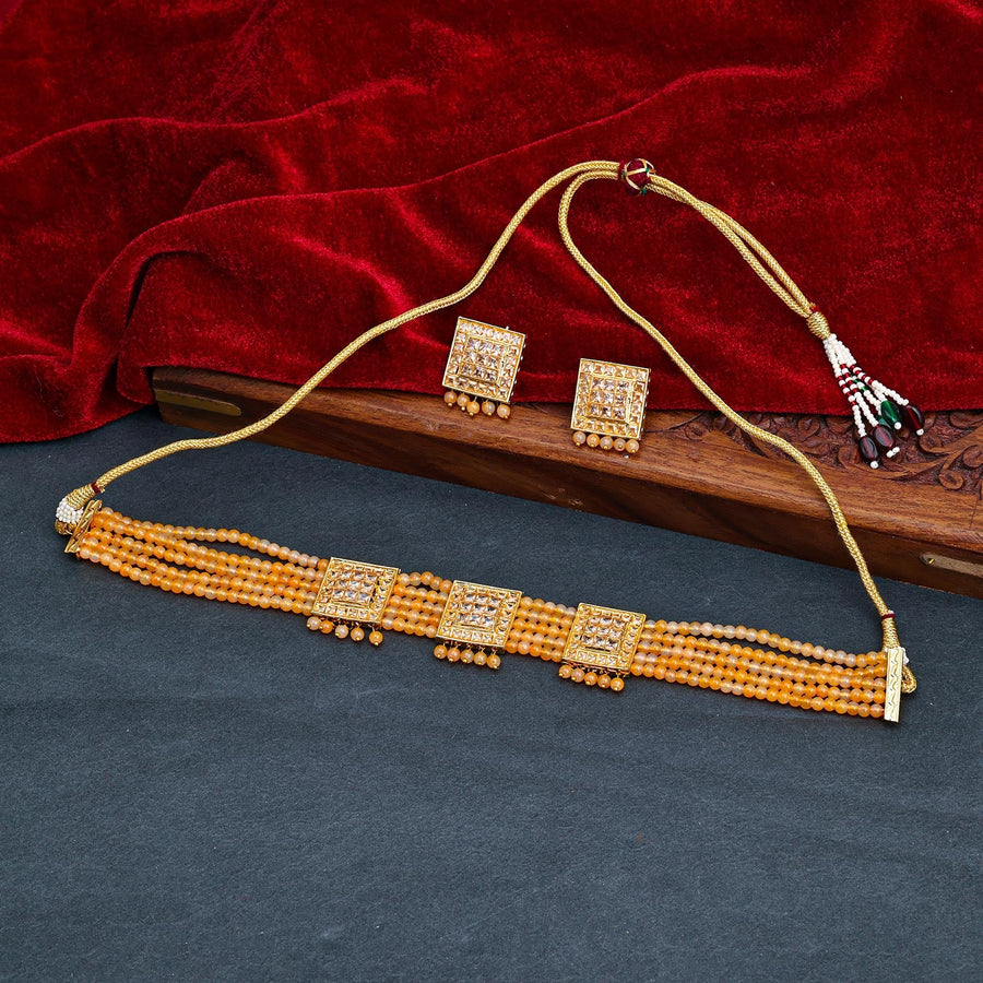 Sukkhi Peach Gold Plated Kundan & Pearl Choker Necklace Set For Women