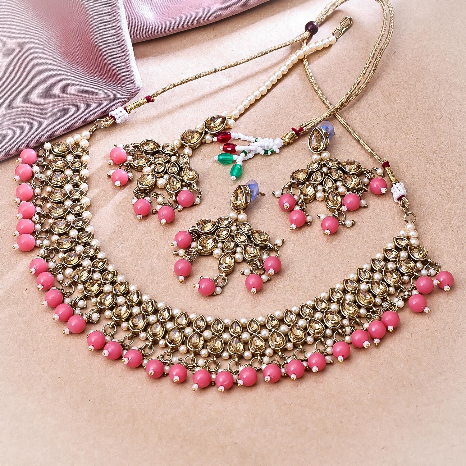 Sukkhi Dazzling Gold Plated Reverse AD & Pearl Peach Necklace Set for Women