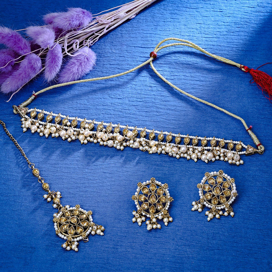 Sukkhi Glittery Gold Plated Reverse AD & Pearl Golden Necklace Set for Women