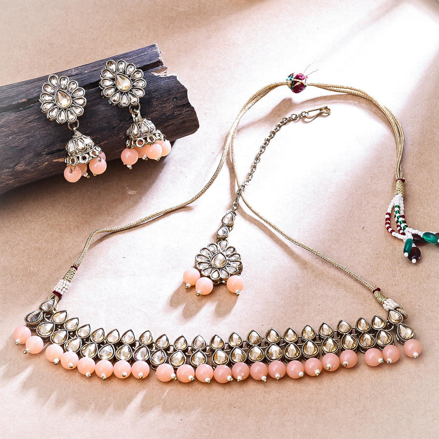 Sukkhi Attractive Gold Plated Reverse AD & Pearl Peach Necklace Set for Women