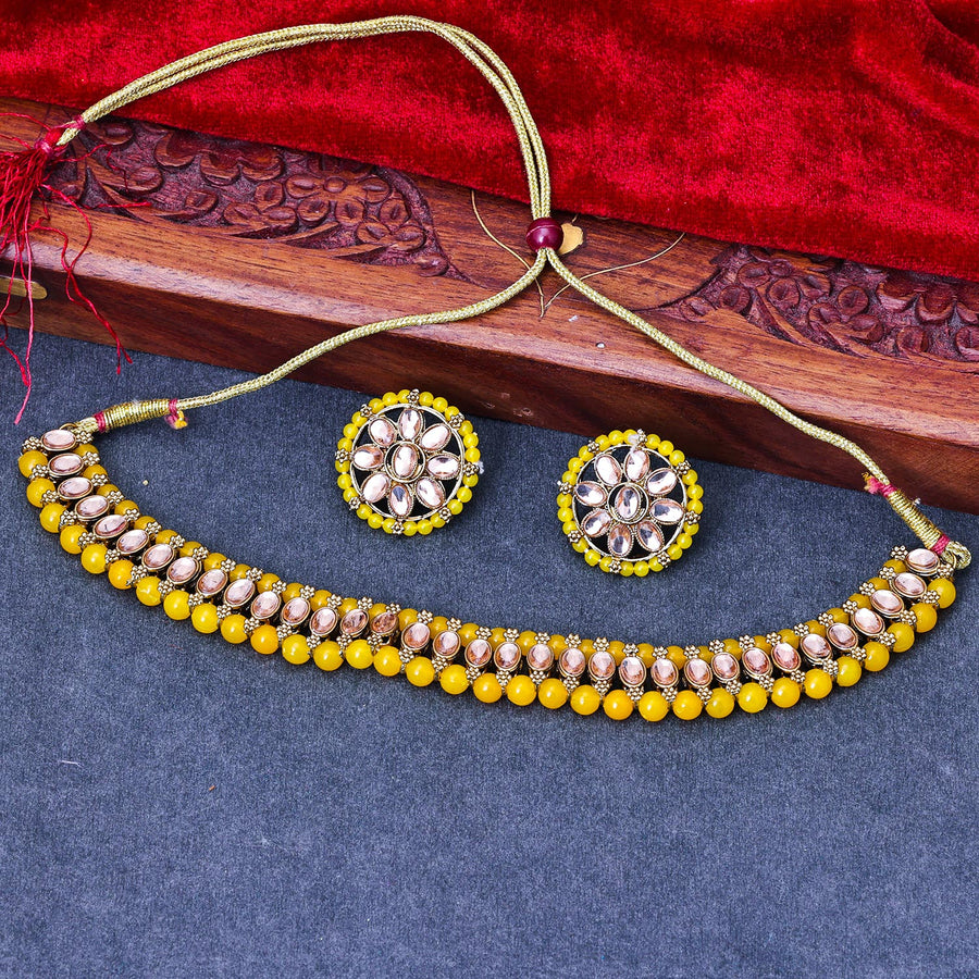 Sukkhi Classy Gold Plated Reverse AD & Pearl Yellow Necklace Set for Women