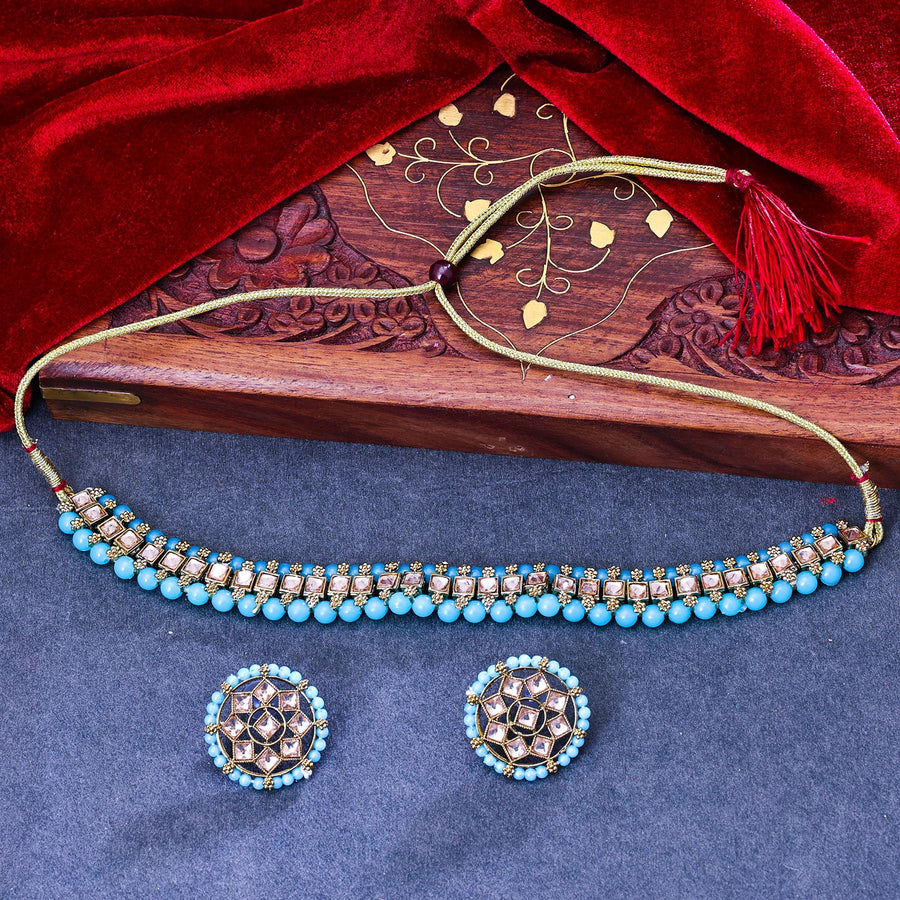 Sukkhi Delightful Gold Plated Reverse AD & Pearl Aqua Necklace Set for Women