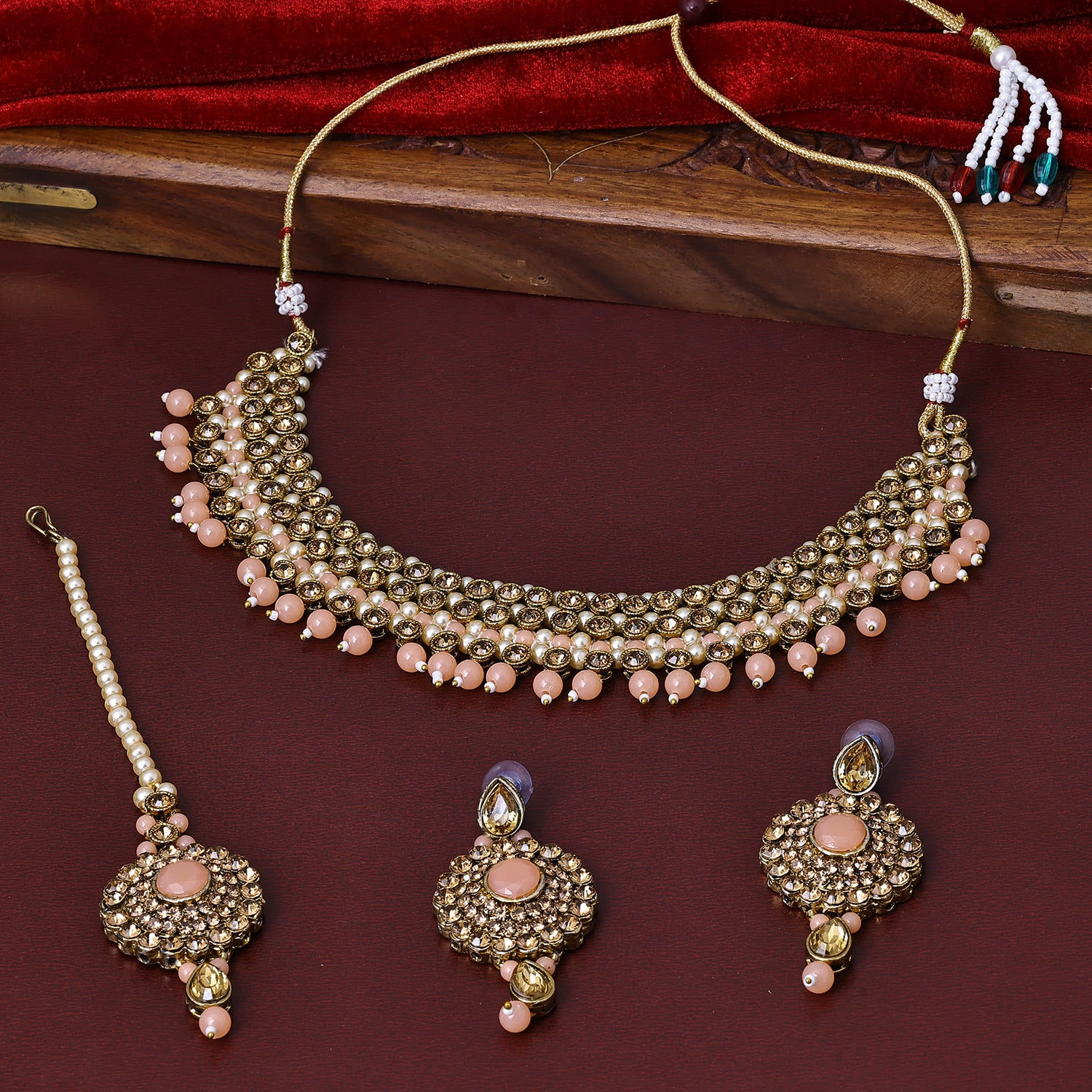 Sukkhi Glamorous Gold Plated Light Pink Pearl Choker Necklace Set With Maang Tikka for Women