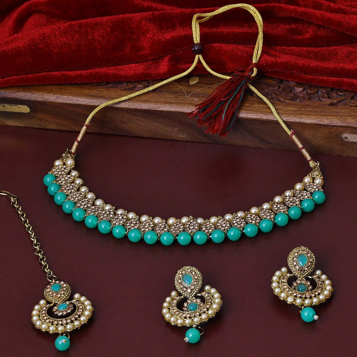 Sukkhi Cute Gold Plated Sky Blue Austrian Stone Choker Necklace Set With Maang Tikka for Women