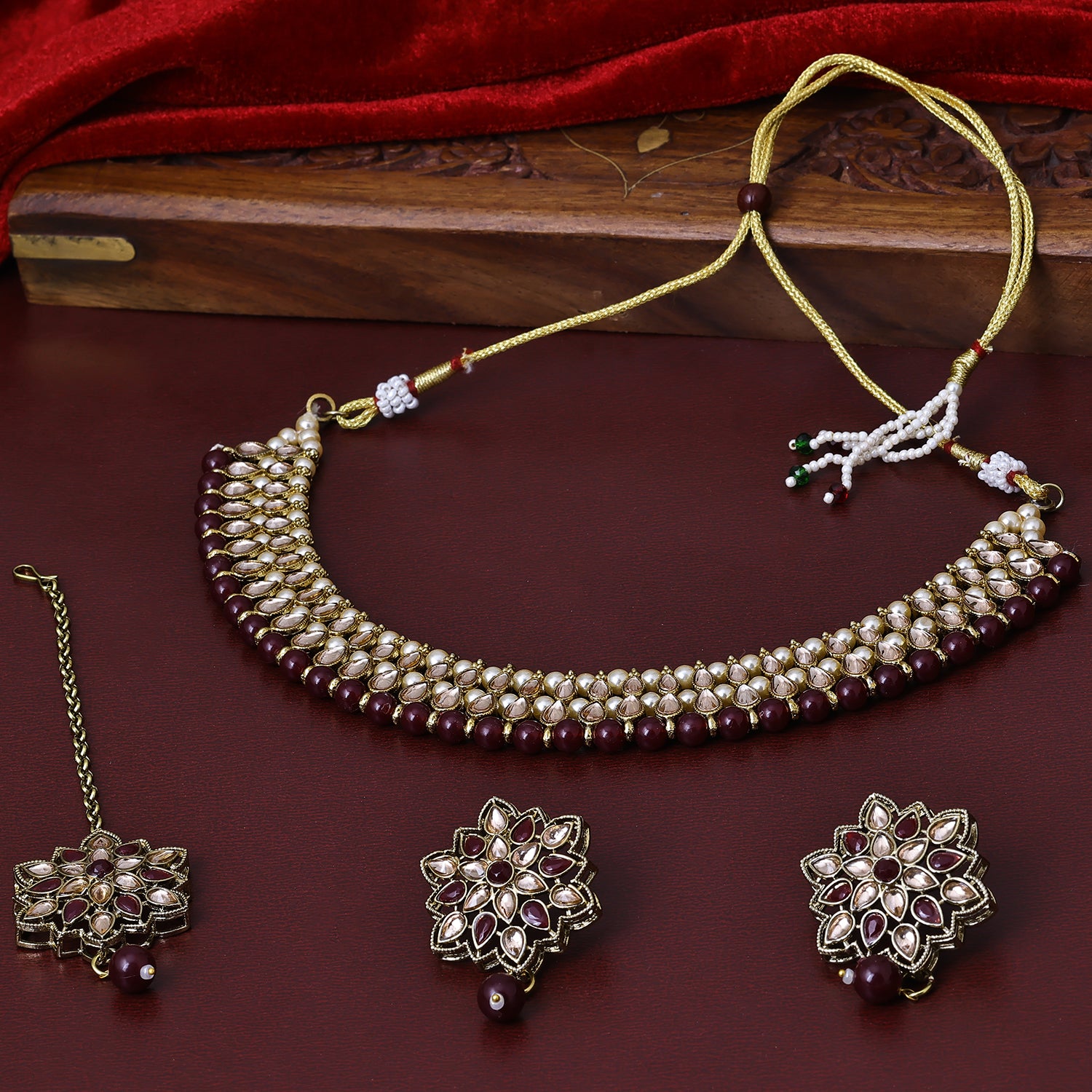 Sukkhi Drop-Dead Gold Plated Maroon Pearl Choker Necklace Set With Maang Tikka for Women