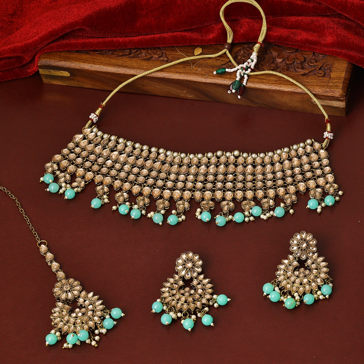 Sukkhi Likely Gold Plated Aqua Green Austrian Stone Collar Necklace Set With Maang Tikka for Women