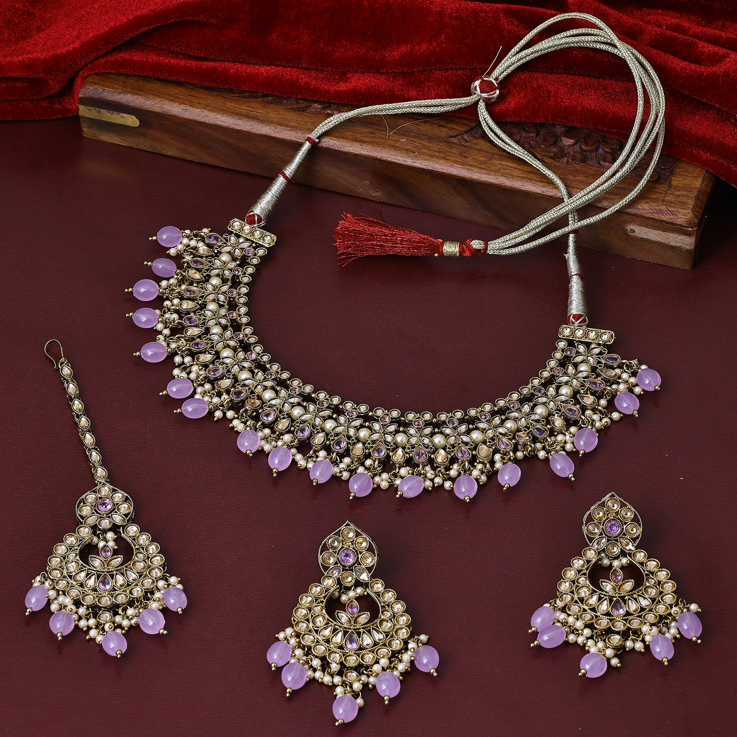 Sukkhi Seemly Gold Plated Light Purple Austrian Stone Collar Necklace Set With Maang Tikka for Women