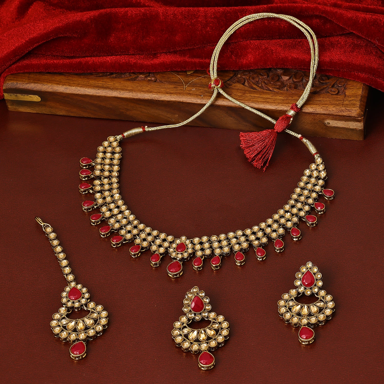 Sukkhi Taking Gold Plated Red Austrian Stone Choker Necklace Set With Maang Tikka for Women
