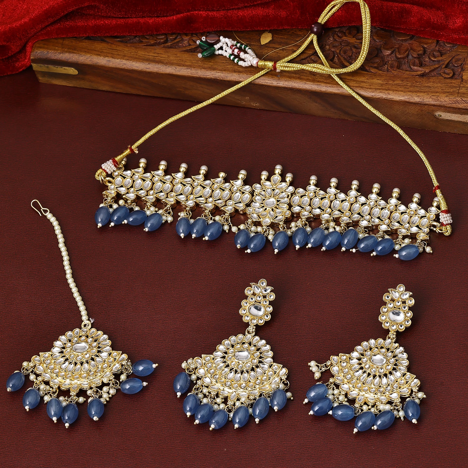 Sukkhi Prepossessing Gold Plated Blue Kundan Choker Necklace Set With Maang Tikka for Women