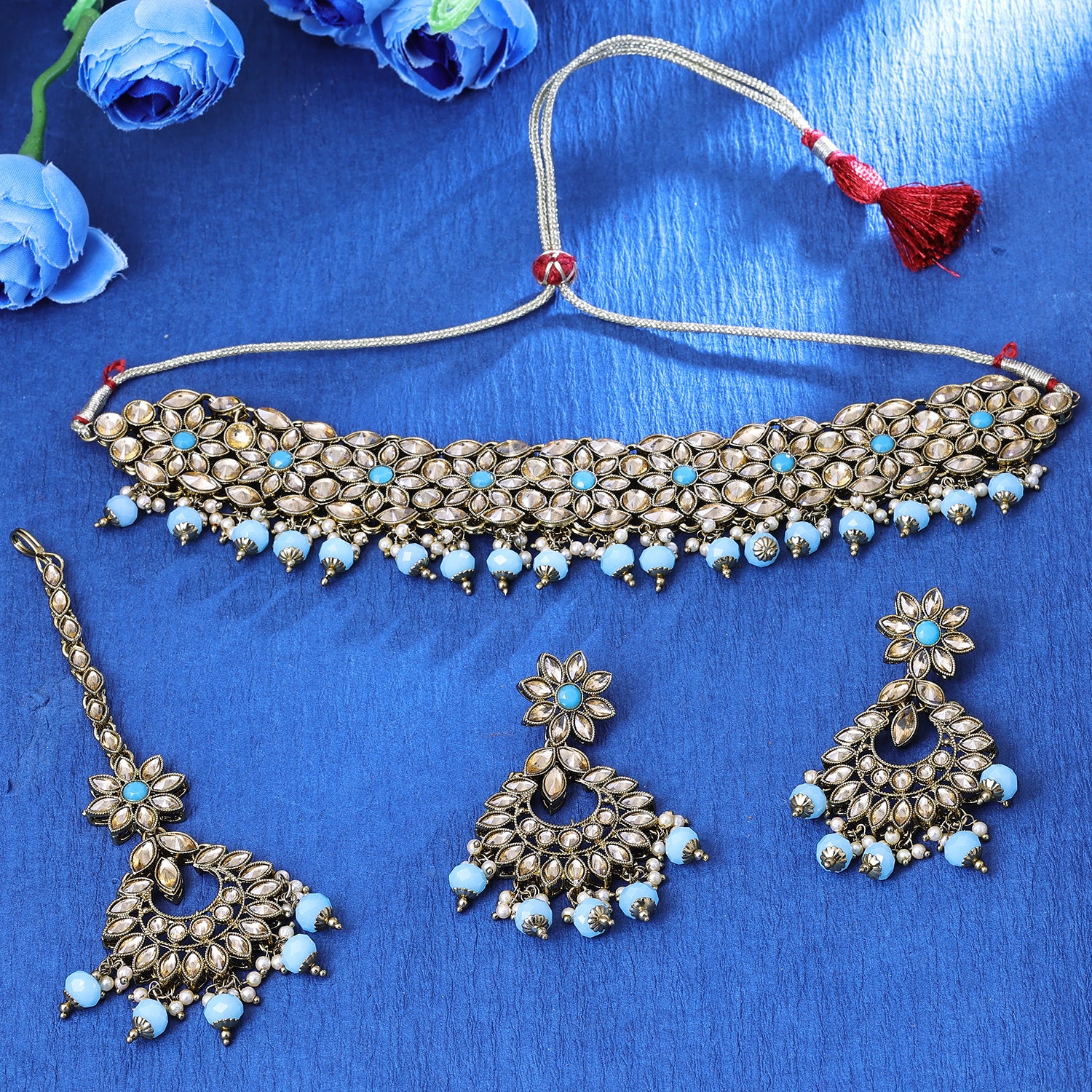Sukkhi Flawless Gold Plated Sky Blue Austrian Stone Choker Necklace Set With Maang Tikka for Women