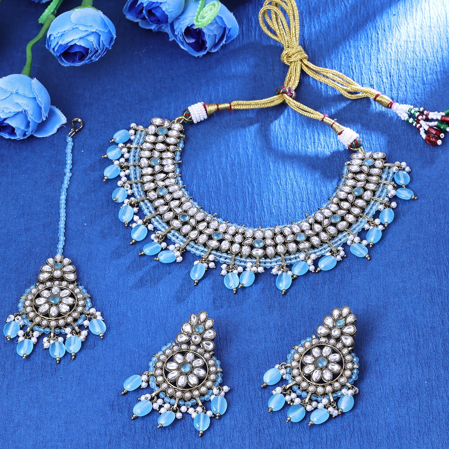 Sukkhi Glossy Gold Plated Sky Blue Crystal Color Stone Collar