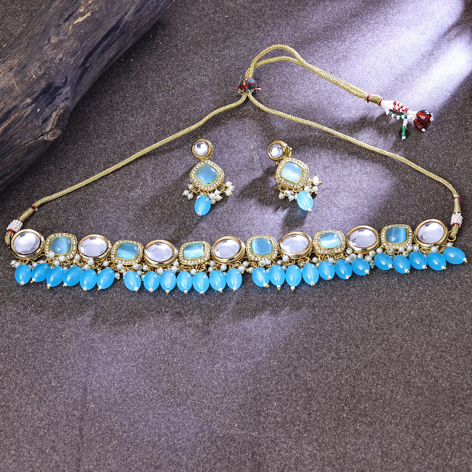 Sukkhi Titillating Gold Plated Sky Blue Color Stone Choker Necklace Set for Women