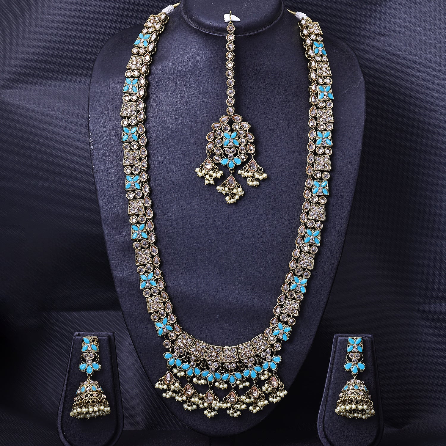 Sukkhi Pleasing Gold Plated Sky Blue Color Stone Long Haram Necklace Set With Maang Tikka for Women