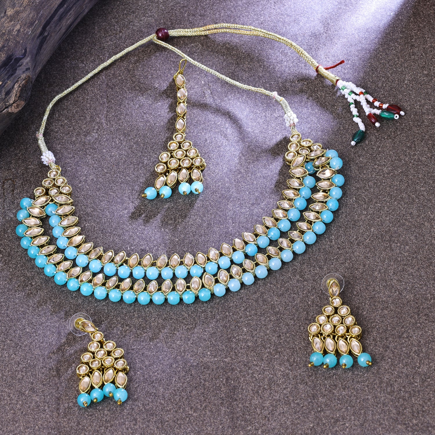 Sukkhi Engrossing Gold Plated Sky Blue LCT Stone Choker Necklace Set With Maang Tikka for Women