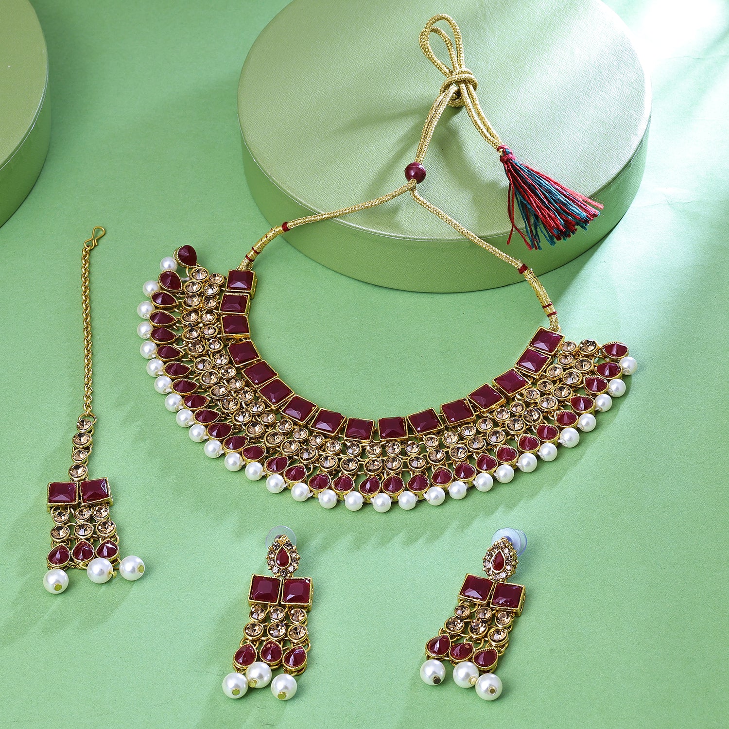Sukkhi Tantalizing Gold Plated Maroon LCT Stone Collar Necklace Set With Maang Tikka for Women