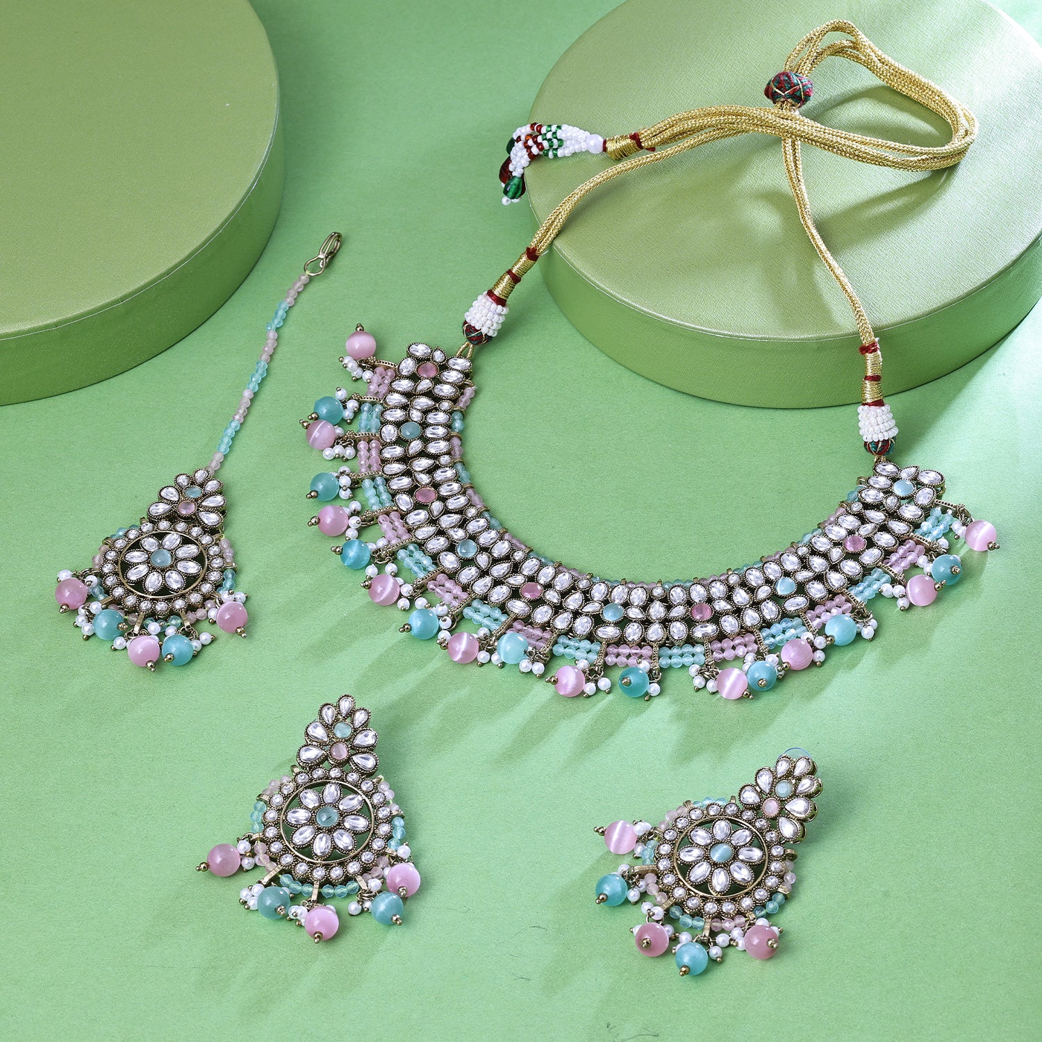 Sukkhi Pleasing Gold Plated Sky Blue Crystal Stone Collar Necklace Set With Maang Tikka for Women