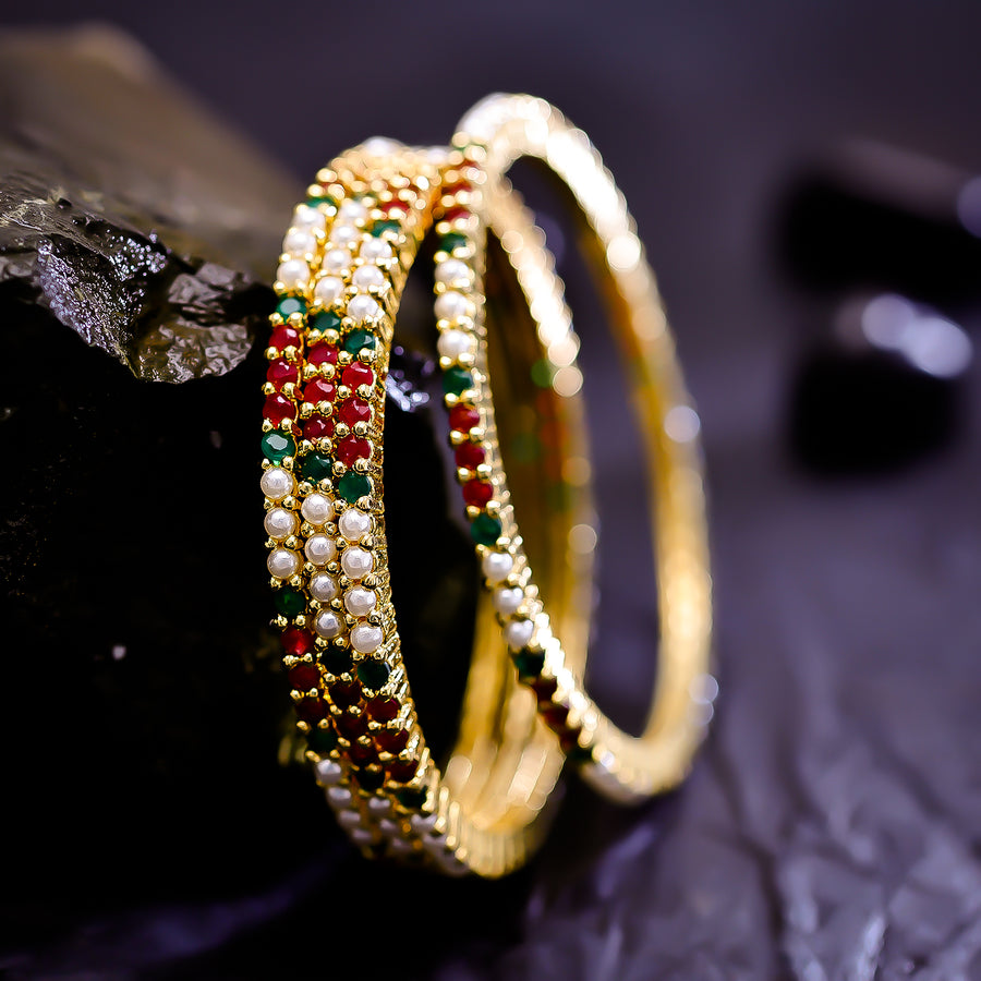 Sukkhi Interesting Multicolor Austrian Stone & Pearl Gold Plated Traditional Set Of 2 Bangles for Women