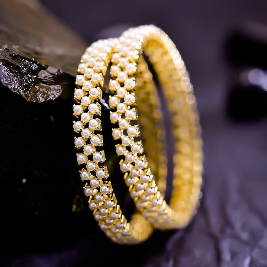 Sukkhi Titillating Golden Austrian Stone & Pearl Gold Plated Traditional Set Of 2 Bangles for Women