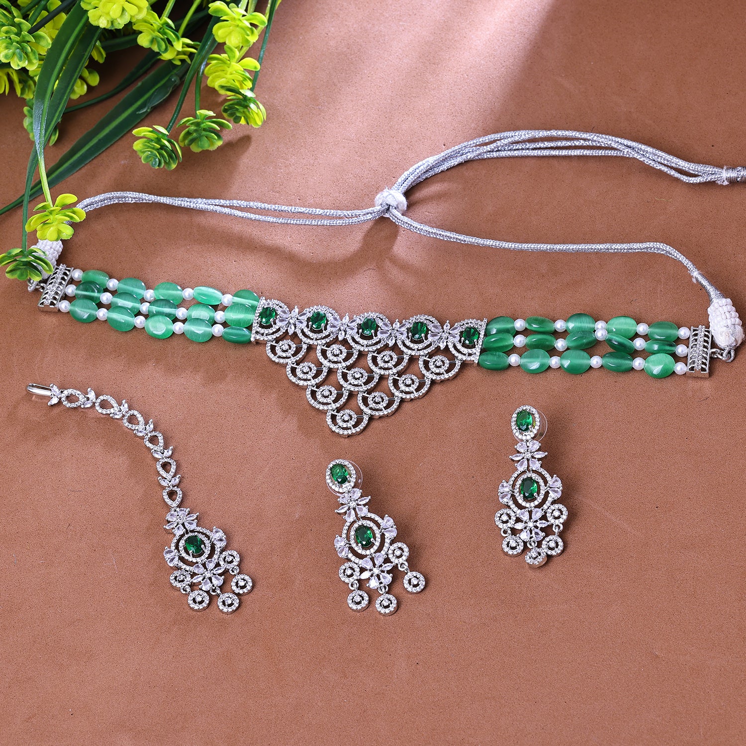 Sukkhi Enchanting Green CZ Stone Rhodium Plated Traditional Necklace Set With Maang Tikka for Women