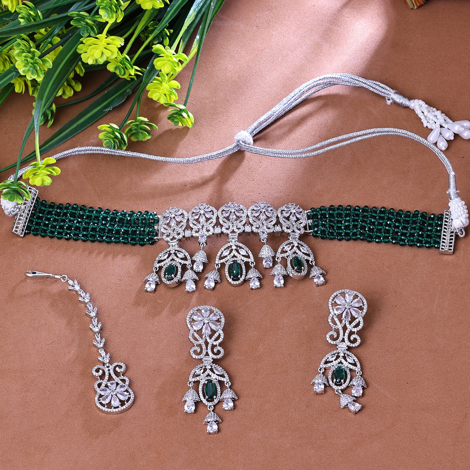 Sukkhi Entrancing Green And Silver Austrian Stone Rhodium Plated Traditional Necklace Set With Maang Tikka for Women