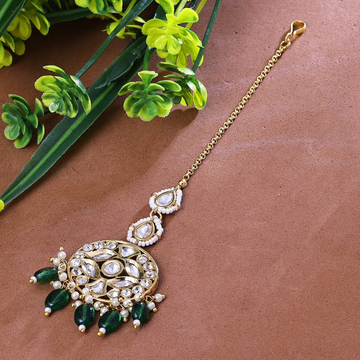 Sukkhi Captivating Green And Golden Austrian Stone Gold Plated Traditional Maang Tikka for Women