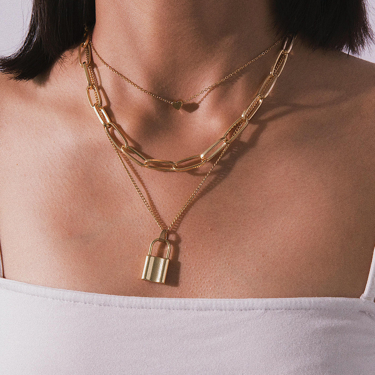 Scintillare by Sukkhi Modish Gold Plated Multi Layered Heart Lock Necklace for Women
